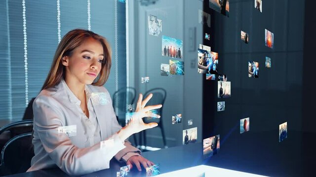 Latina woman watching visual contents in dark office. Digital contents concept. Social networking service. Streaming video. communication network. 