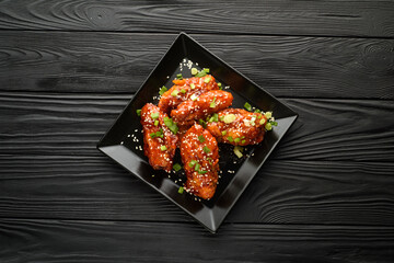 Chicken wings. Traditional asian recipe. Dark background. Copy space. Top view.