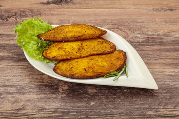 Baked potato with herbs and spices