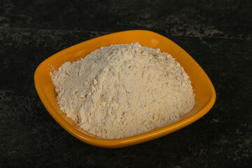 Wheat flour heap in the bowl