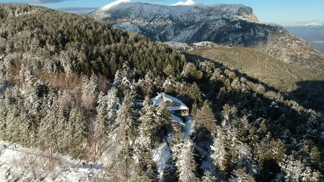 Aerial view of the snowy mountain Taygetus (also known as Taugetus or Taygetos) above Messenia unit in Peloponnese, Greece. Amazing natural scenery of the highest mountain in Peloponnese during winter