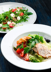 two salads of fresh vegetables on the table