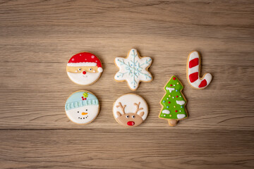 Merry Christmas with homemade cookies on wood table background. Xmas, party, holiday and happy New Year concept