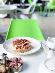 bruschetta with jamon in a white plate