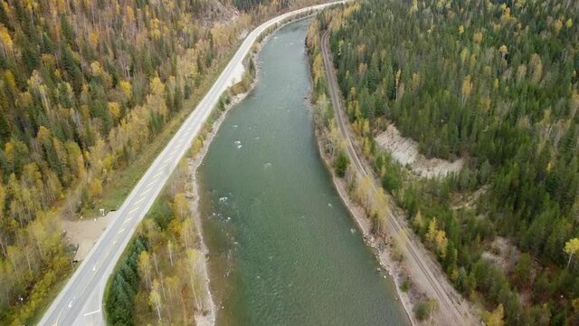 Cars traveling alongside the Fraser River in Canada's Rocky Mountains
