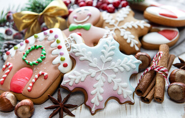 Christmas gingerbread with christmas decorations on white wooden