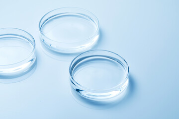 Petri dish with water and ripple in blue background