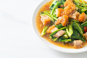 Stir-fried kale vegetable with crispy pork