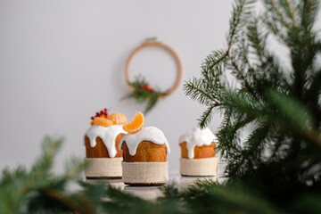 Christmas is coming. Traditional Christmas cake with decorated tangerines, dried apricots, berries.
