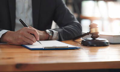 businessman hand writing note on clipboard. Real estate concept, judge gavel or lawyer in auction...