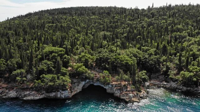 Boat Sailing At The Edge Of Foki Beach In Kefalonia Greece - Aerial shot