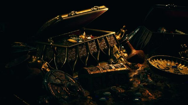 treasures in a dark cave with coins diamonds and gold