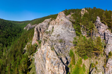 Steep slopes of the Primorsky ridge on the shore of Lake Baikal
