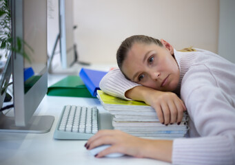 young woman is sad at the workplace. office work concep