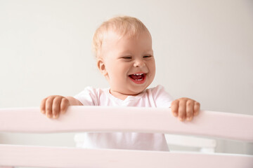 Adorable little baby in crib