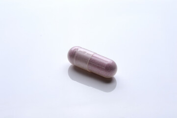 close up of medical capsules on white background