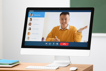 School teacher conducting lesson online