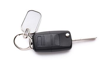 Stylish keychain with car key on white background