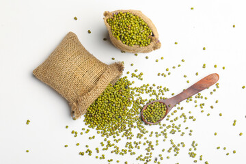 Green gram or mung bean in bag over white background.
