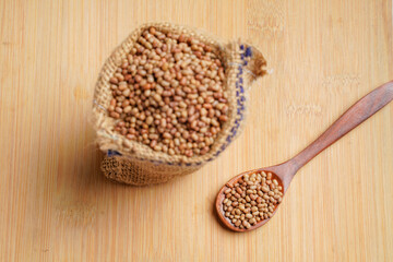 moth bean or math in bag and wooden spoon on wooden background