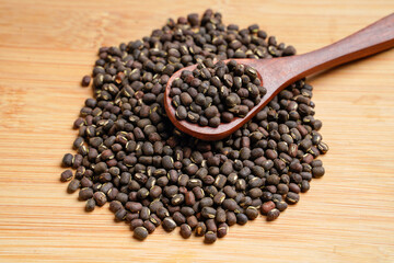 Fresh black gram or udad in wooden spoon