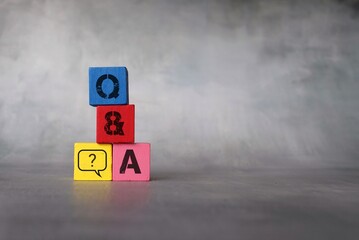 Question and answer concept. Wooden cubes with letter Q,A and question mark icon. Copy space for...