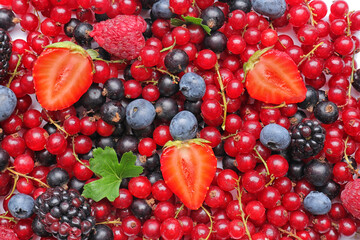 Tasty different berries as background
