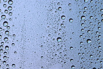 drops glass blue background abstract, transparent cold background water splashes