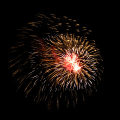 Colorful celebration fireworks isolated on black sky background.