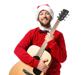 Young man in Santa hat with guitar on white background