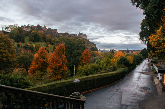 Edinburgh Castle, a historic construction in Scotland. It stands on Castle Rock. Landmarks of United Kingdom. Photo taken during a cloudy autumn morning from Princess Street Gardens.