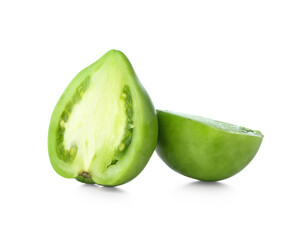 Halves of fresh green tomato on white background