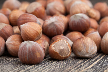 whole hazelnuts on a wooden table,in shell