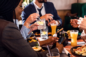 Group of people sitting in a restaurant at a business lunch.