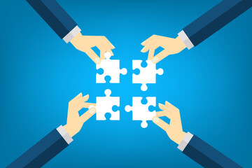 Teamwork. Business concept. Team connecting puzzle elements. Symbol of teamwork, cooperation, partnership.