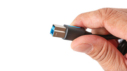 Hands holding a USB B-male type cable plug isolated on white background.