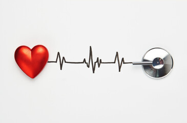 Heart and stethoscope with cardiogram isolated on white
