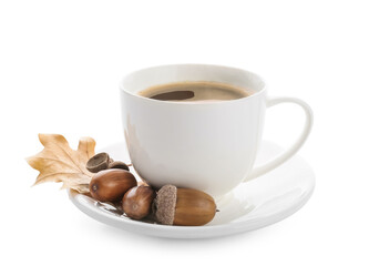 Cup of coffee with acorns on white background