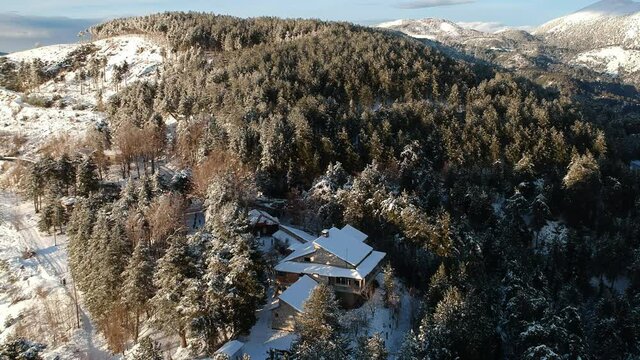 Aerial view of the snowy mountain Taygetus (also known as Taugetus or Taygetos) above Messenia unit in Peloponnese, Greece. Amazing natural scenery of the highest mountain in Peloponnese during winter