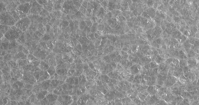 The texture of the soft film is close-up. Macro fragment of packaging material.