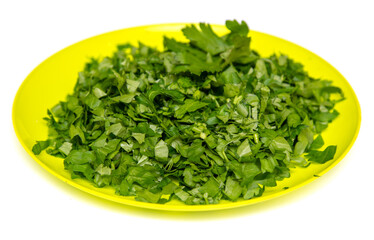 Green chopped parsley isolated on a white background.