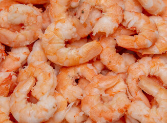 Peeled red shrimp meat as background.