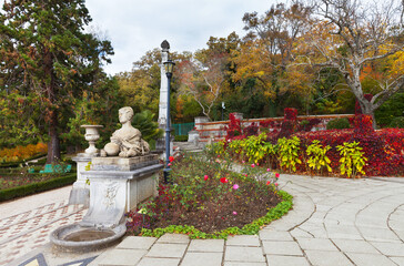 Massandra, Yalta, Crimea. A picturesque autumn park with sculptures of sphinxes in the courtyard of the Imperial Palace of Alexander III or Massandra Palace