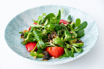 fresh salad with avocado and tomato