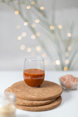 Homemade salted caramel in a glass jar. Delicious sauce with sea salt for ice cream and desserts. Selective focus