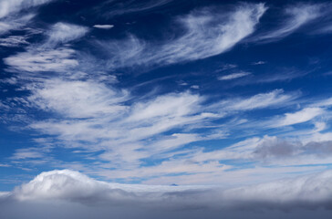 shot from Gran Canaria, the very tip of Teide just visible over low sea of clouds, high cirrus above 
