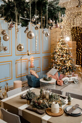 Modern design Christmas tree decorated with balls, toys and garlands. Christmas or New Year background. Winter holidays composition.