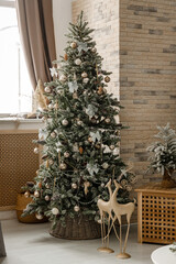 Modern design Christmas tree decorated with balls, toys and garlands. Christmas or New Year background. Winter holidays composition.