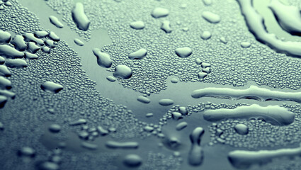 Macro background with water droplets condensation pattern on metal surface 