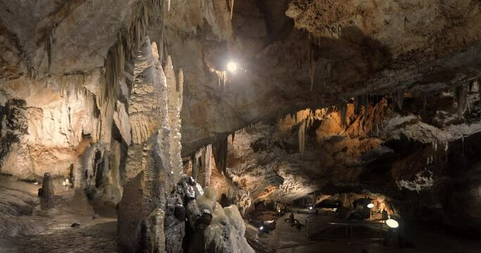 Beautiful shots of karst cave, Lipa Cave situated Serbia, East Europe. Illuminated dark cave with stalactites and stalagmites. Unique nature landscape. High quality 4k footage